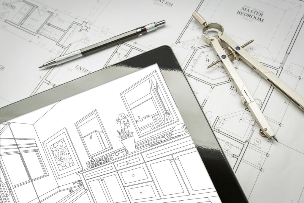 Computer Tablet with Master Bathroom Design Over House Plans, Pencil and Compass